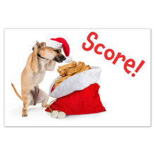 Load image into Gallery viewer, Christmas card - chihuahua with a Santa cap on exclaims &quot;Score!&quot; when he finds a Santa sack full of dog treats. The word Score! is in red font! 
