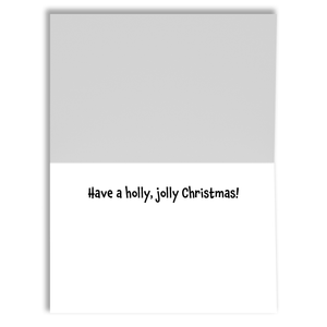 The inside of a Christmas card that says, "Have a holly, jolly Christmas!" in black font.