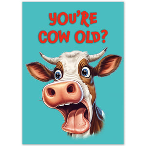 Close-up of the front of the "You're Cow Old?" birthday card with red text and a cartoon cow.